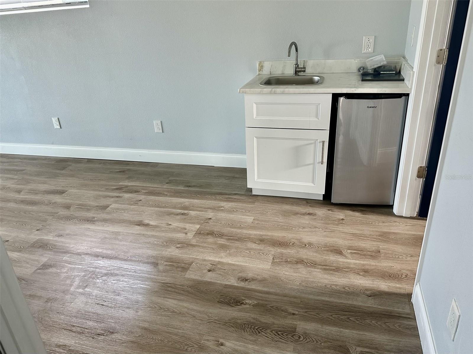 Wet bar in primary bedroom