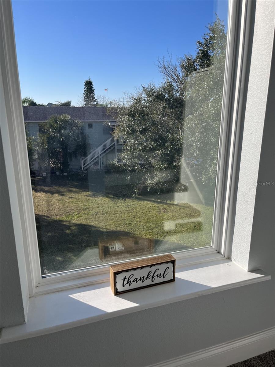 Looking west through window in the stairs