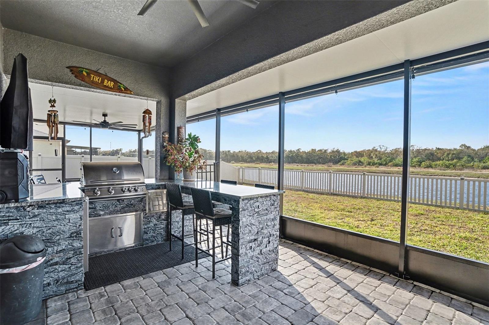 built in bbq on screened in extended patio