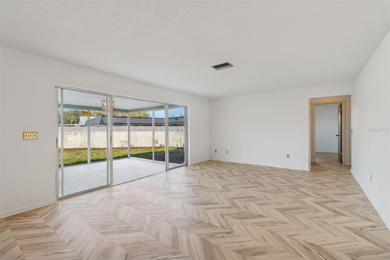 Sliders out to screened porch and leading out to dock!