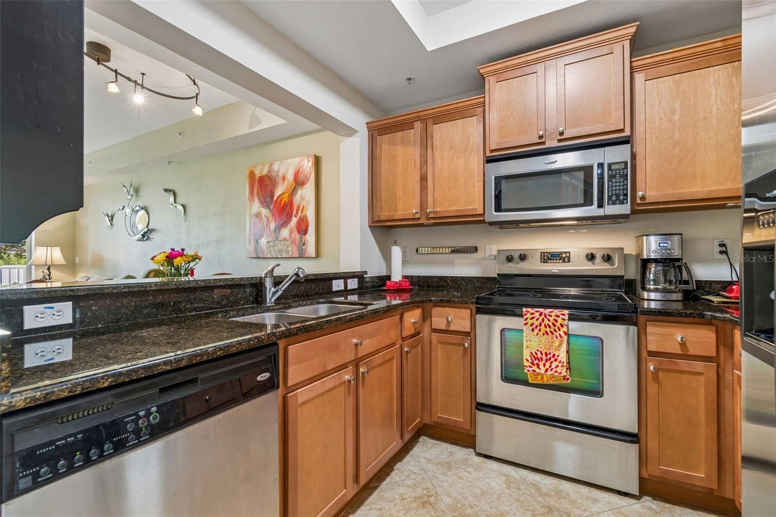 Granite countertops stainless appliances with view to the canal