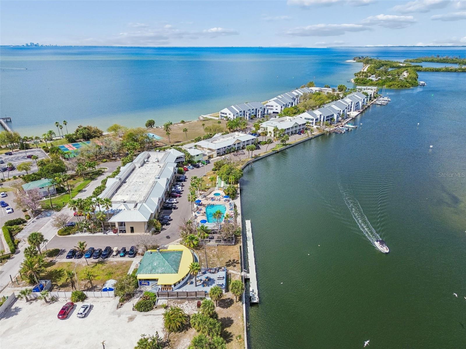 Amenity center with pool and spa, overlooks the marina