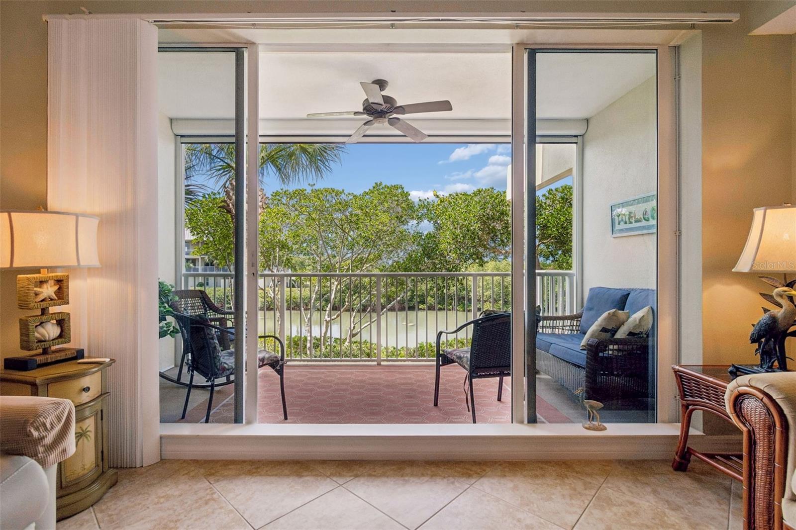 View from inside living room. Manatees are in the water.