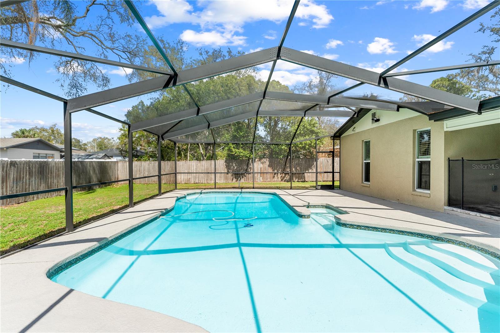 Pool with screened enclosure with Nebula light rails