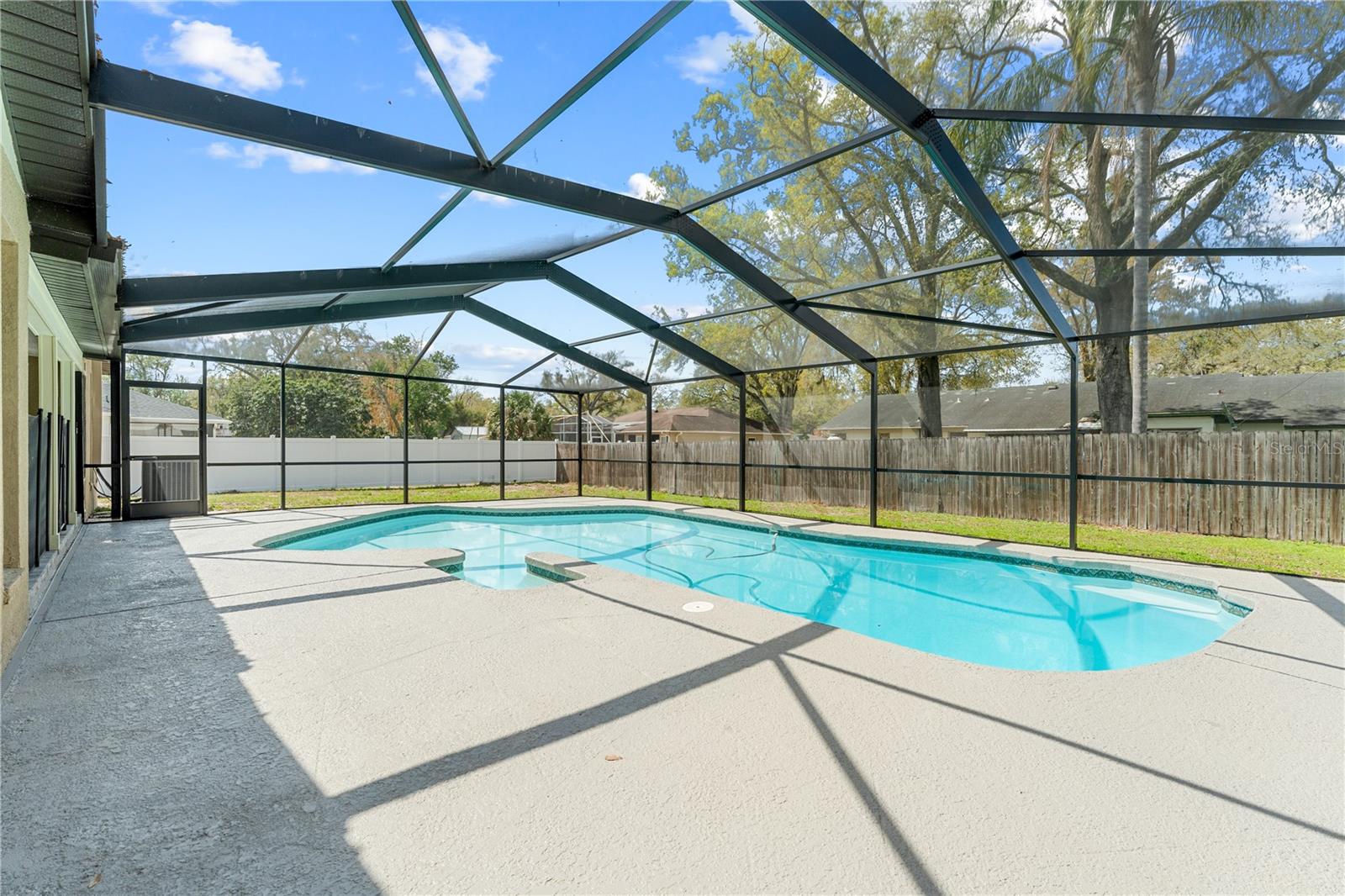 Pool with screened enclosure with Nebula light rails