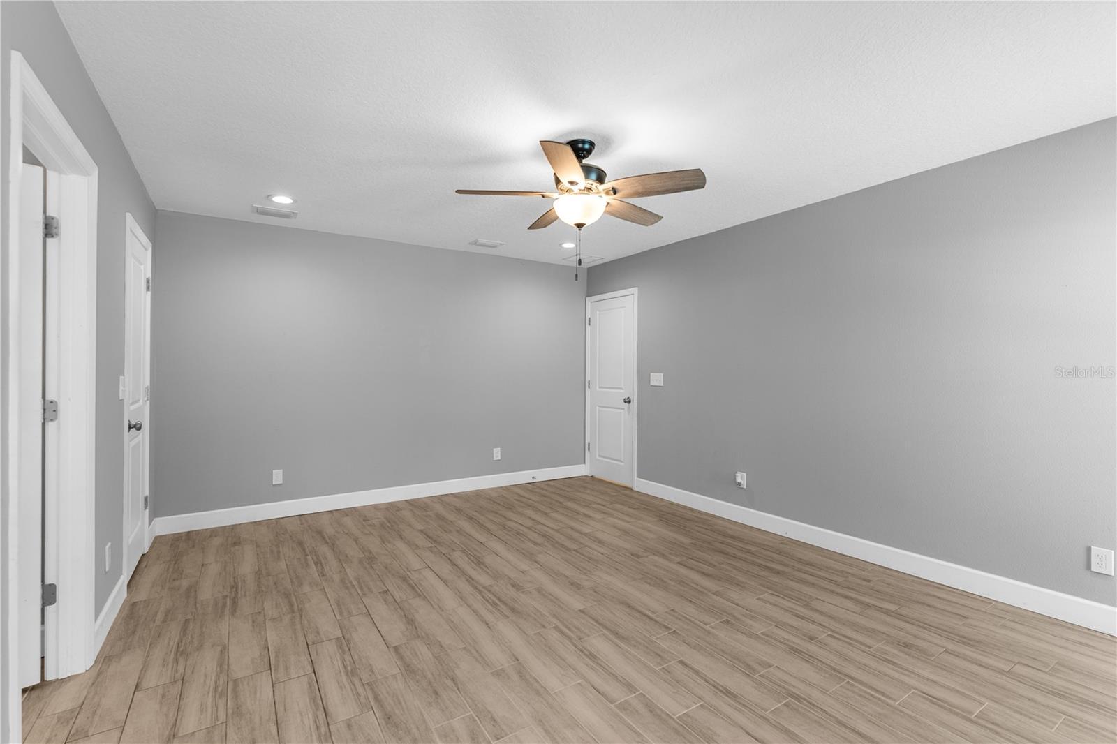 Primary bedroom with walk-in closet