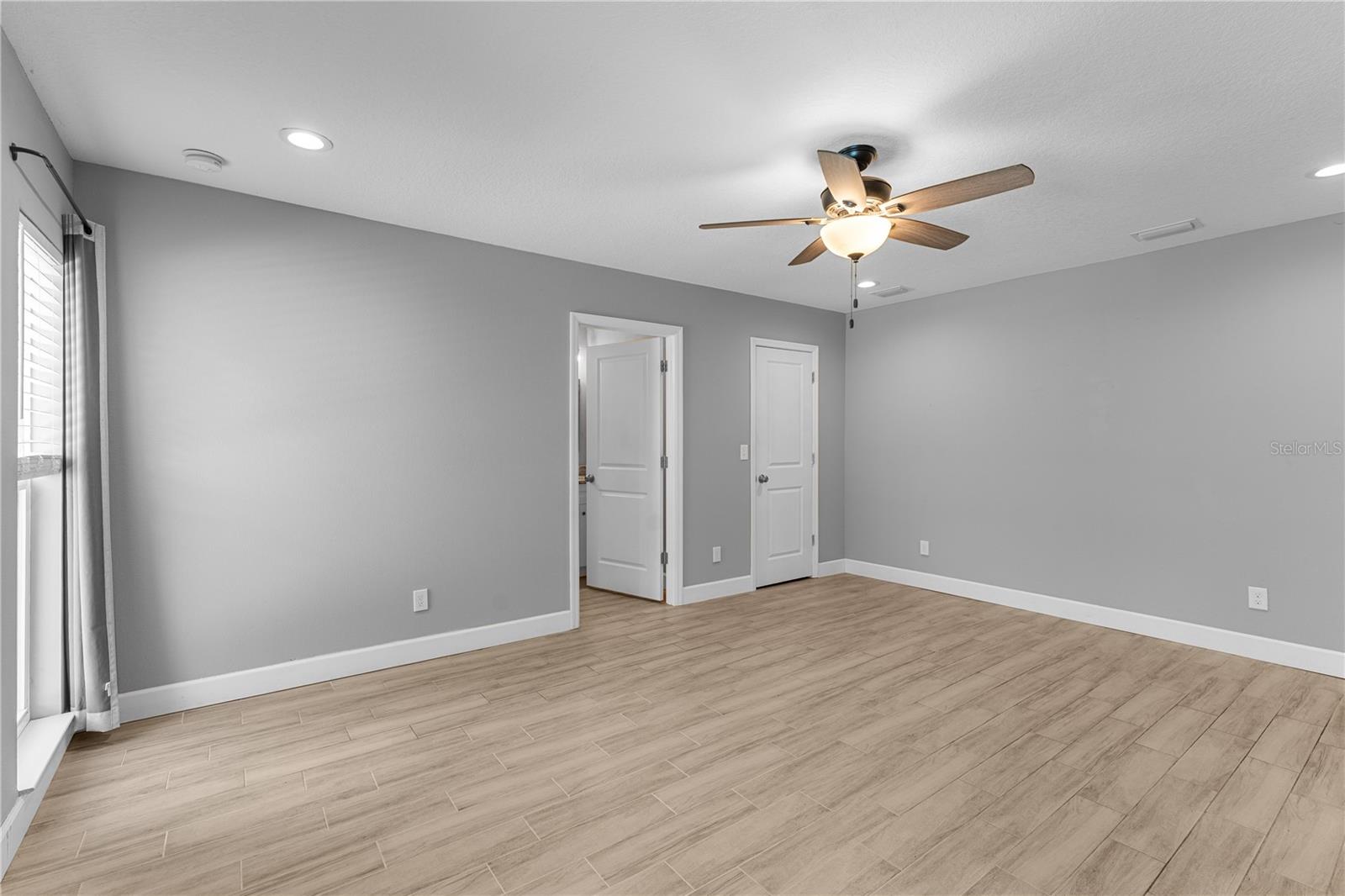 Primary bedroom with walk-in closet