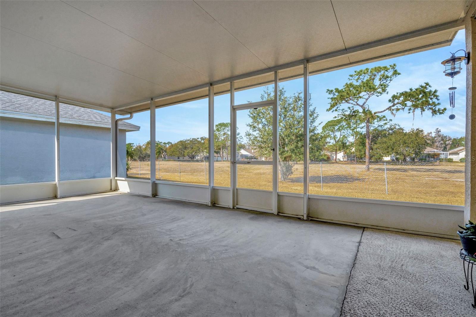 Back screened porch with golf course view
