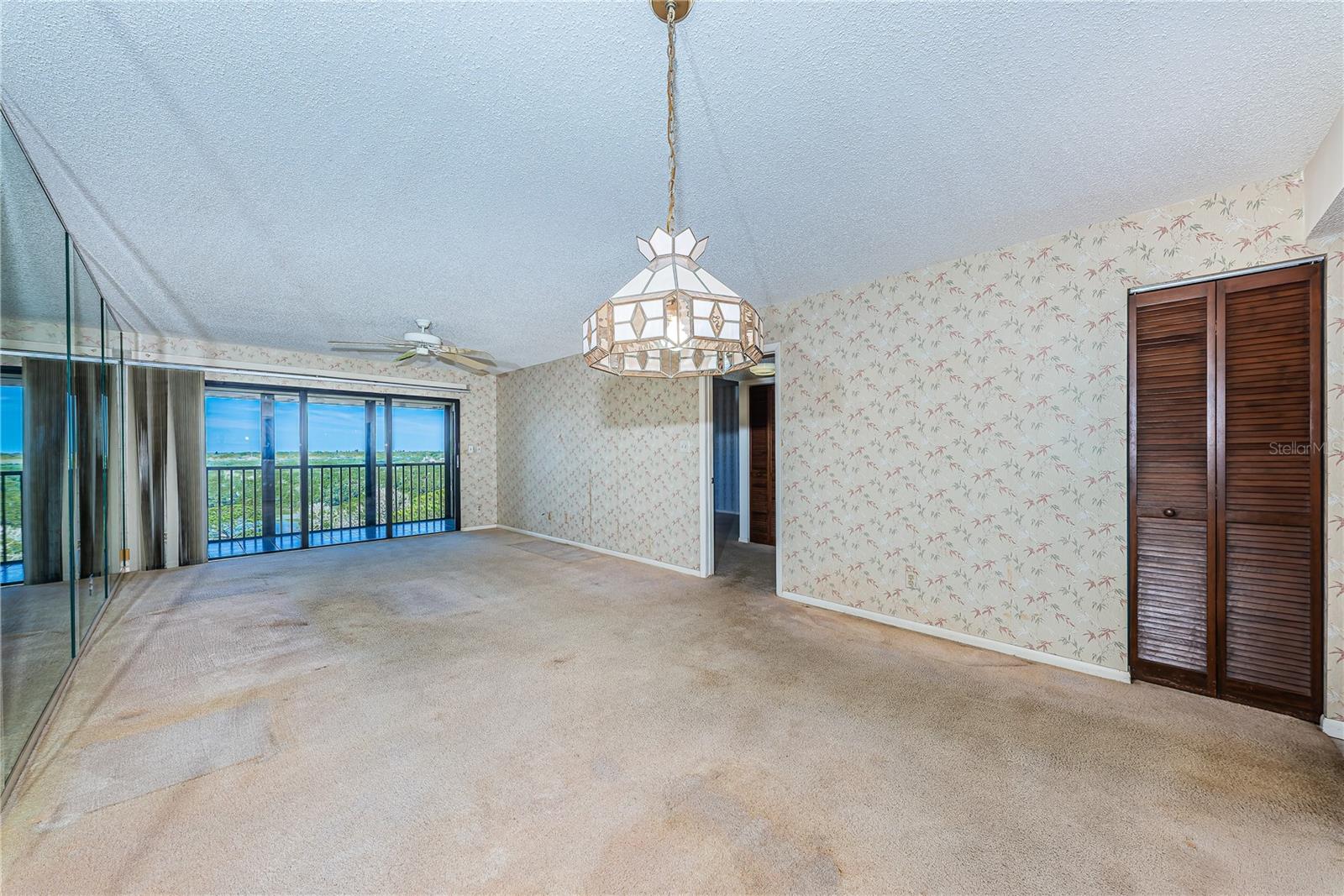 living room w/ doors to balcony