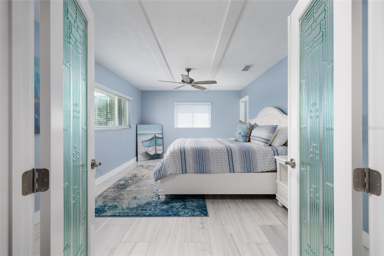 Custom etched glass double door entrance to primary