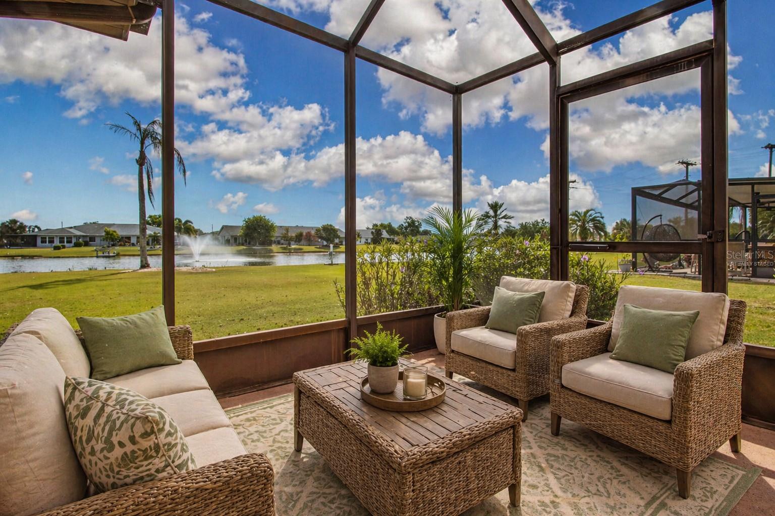 Screened Lanai w/view of Lake (Virtually staged)