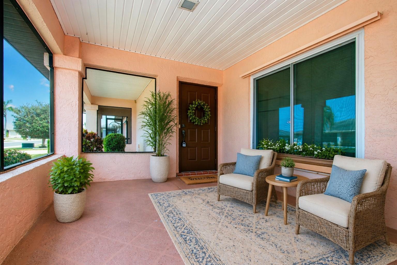 Enclosed, screened in Front Porch (Virtually staged)