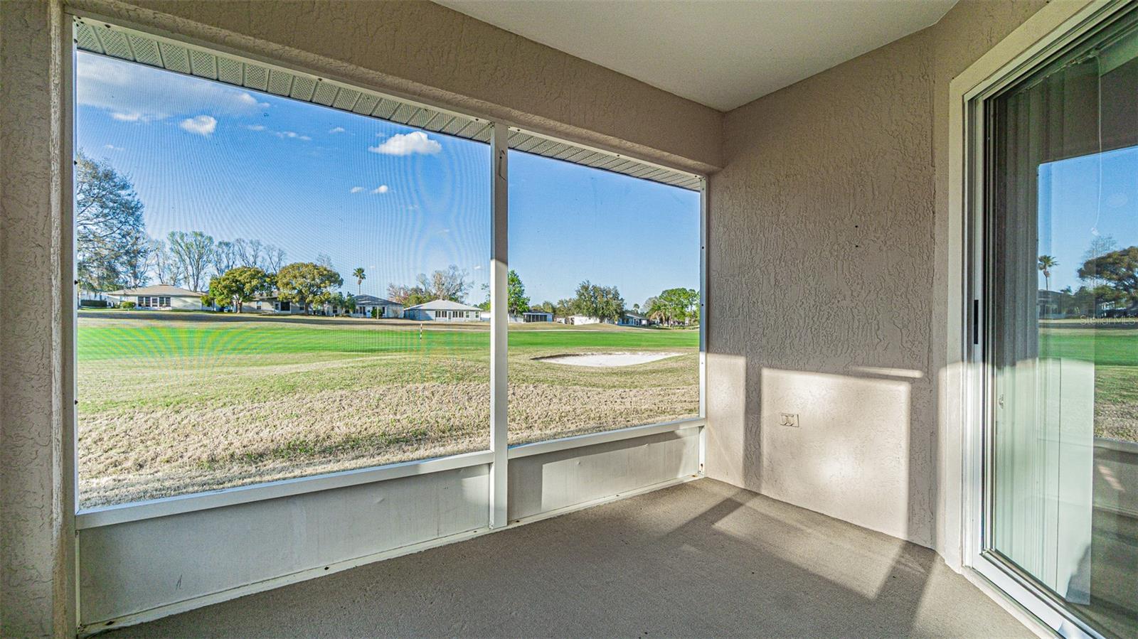 Screened back porch with a view