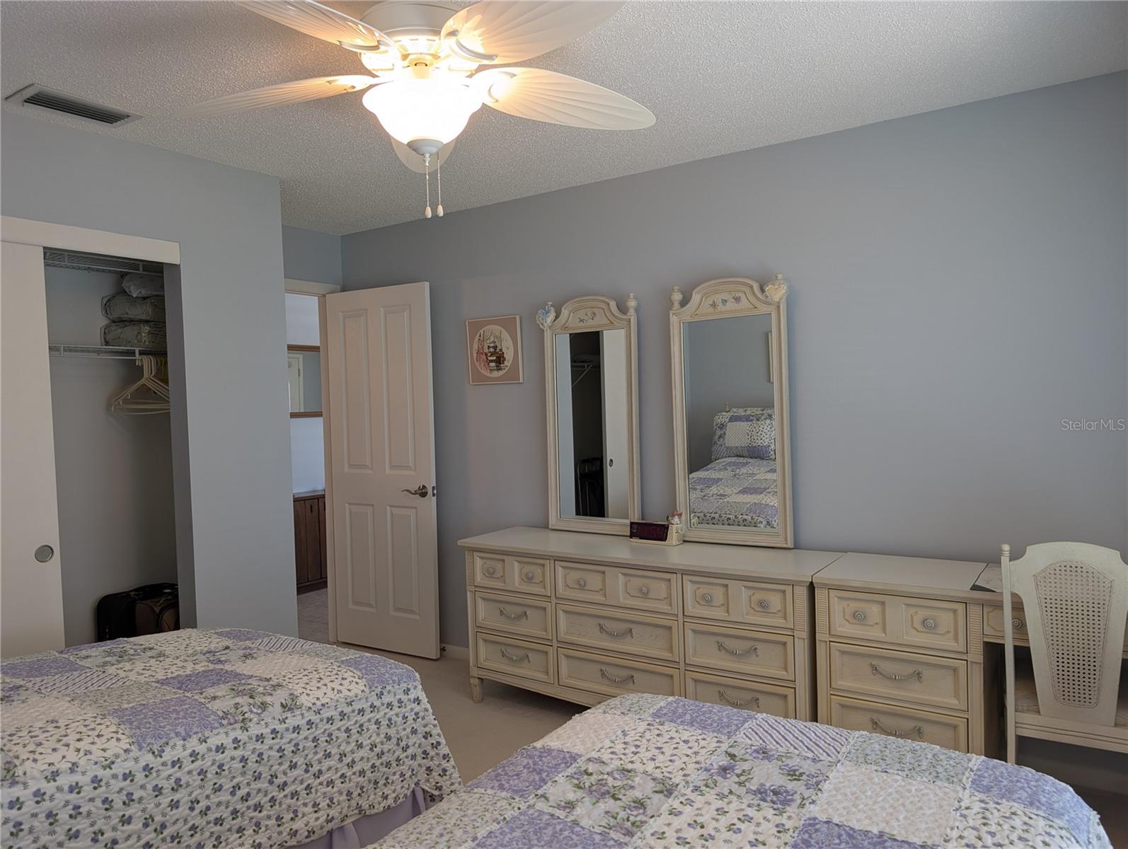 View to living room, new interior door and wall closet.