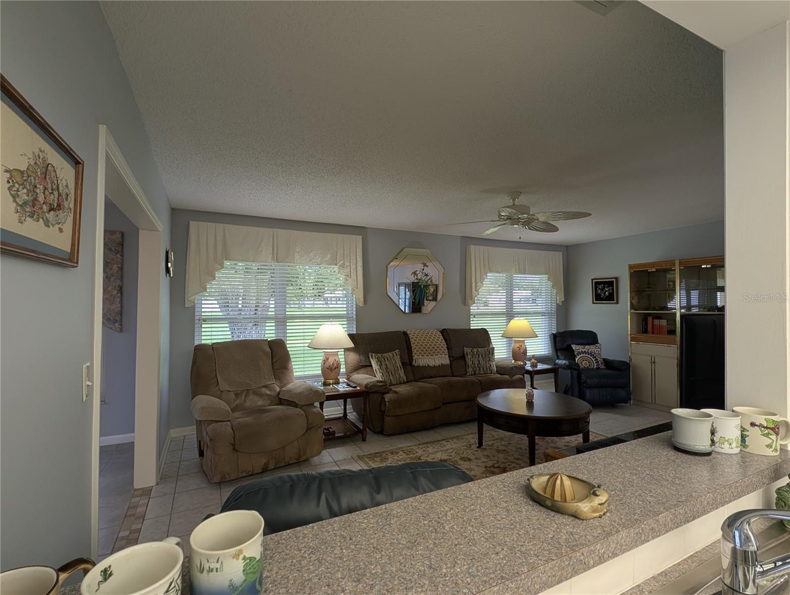 View of Bonus room entrance into Florida room from kitchen pass thru window.