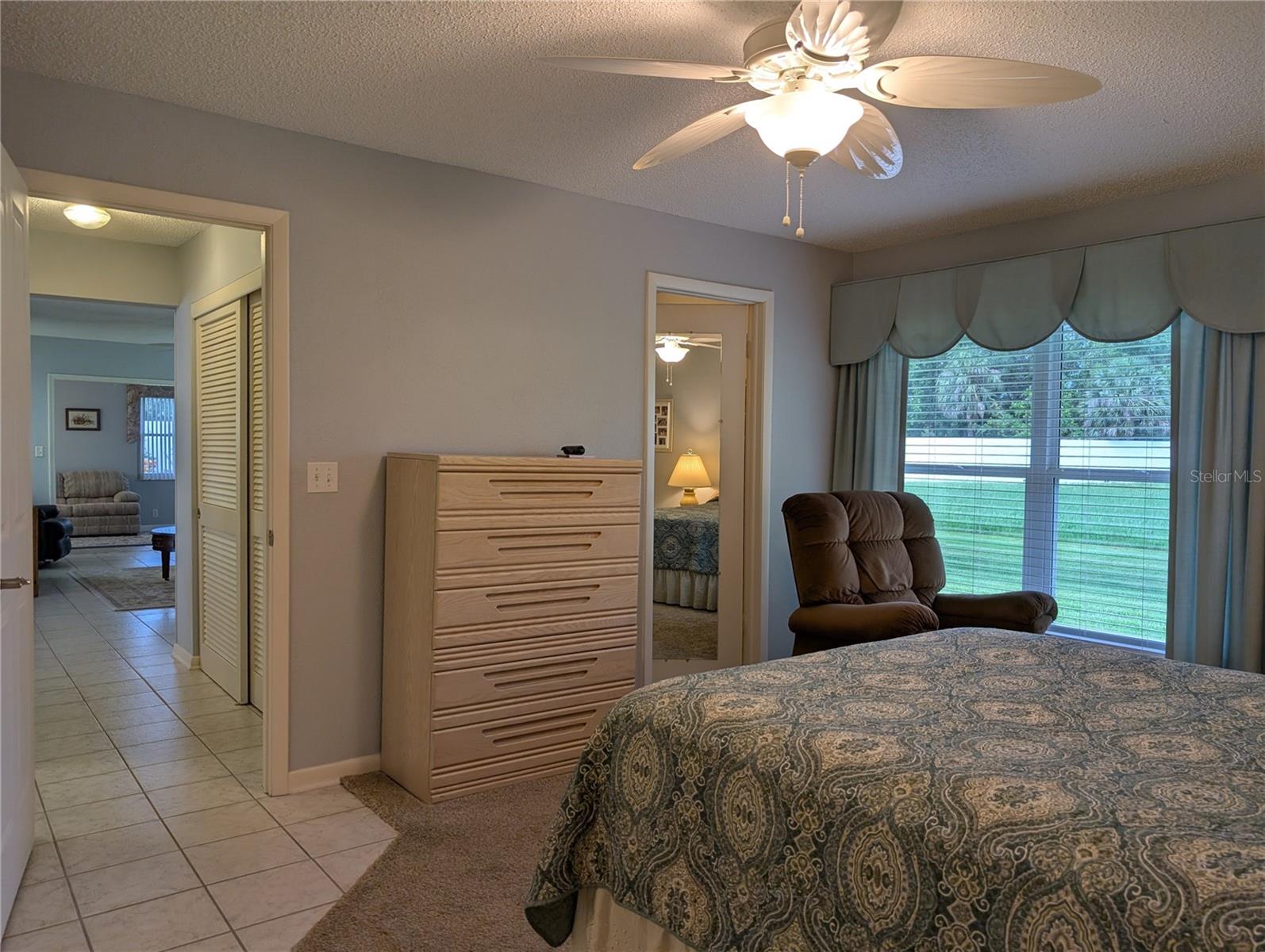 View from primary bedroom down hallway to Florida room.