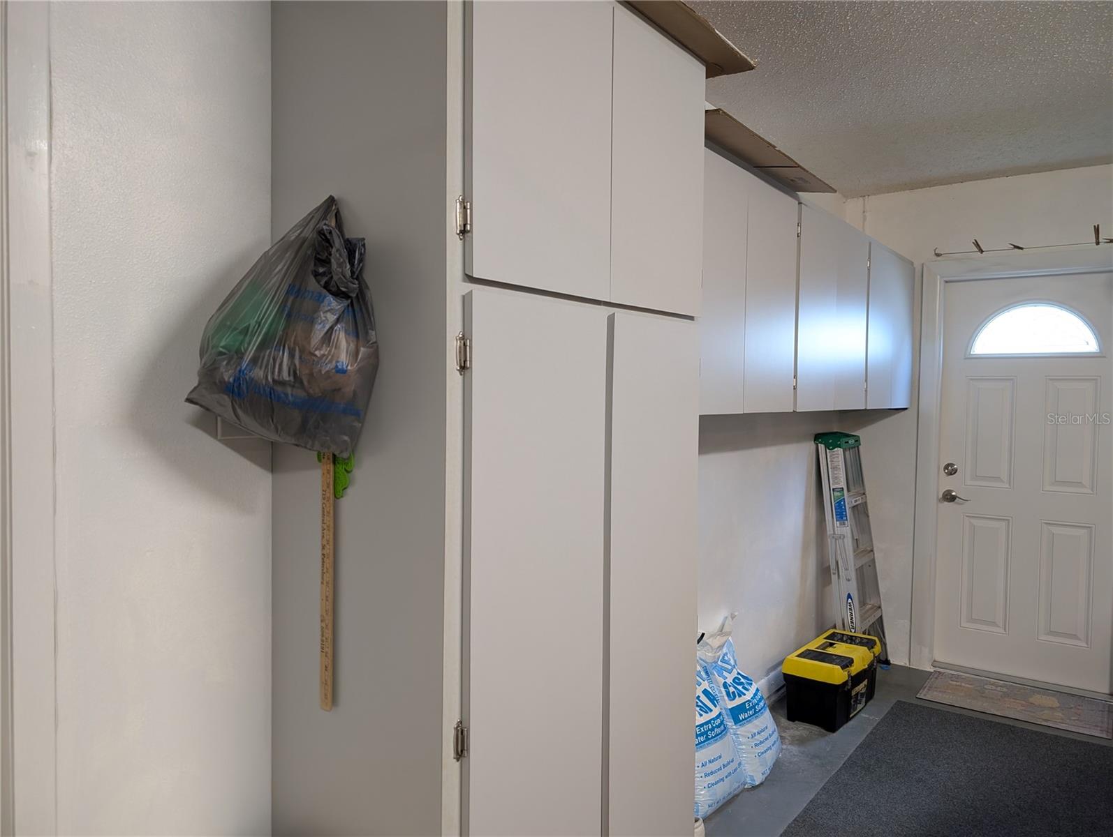 More storage and fiberglass exterior door to access side yard (2015).