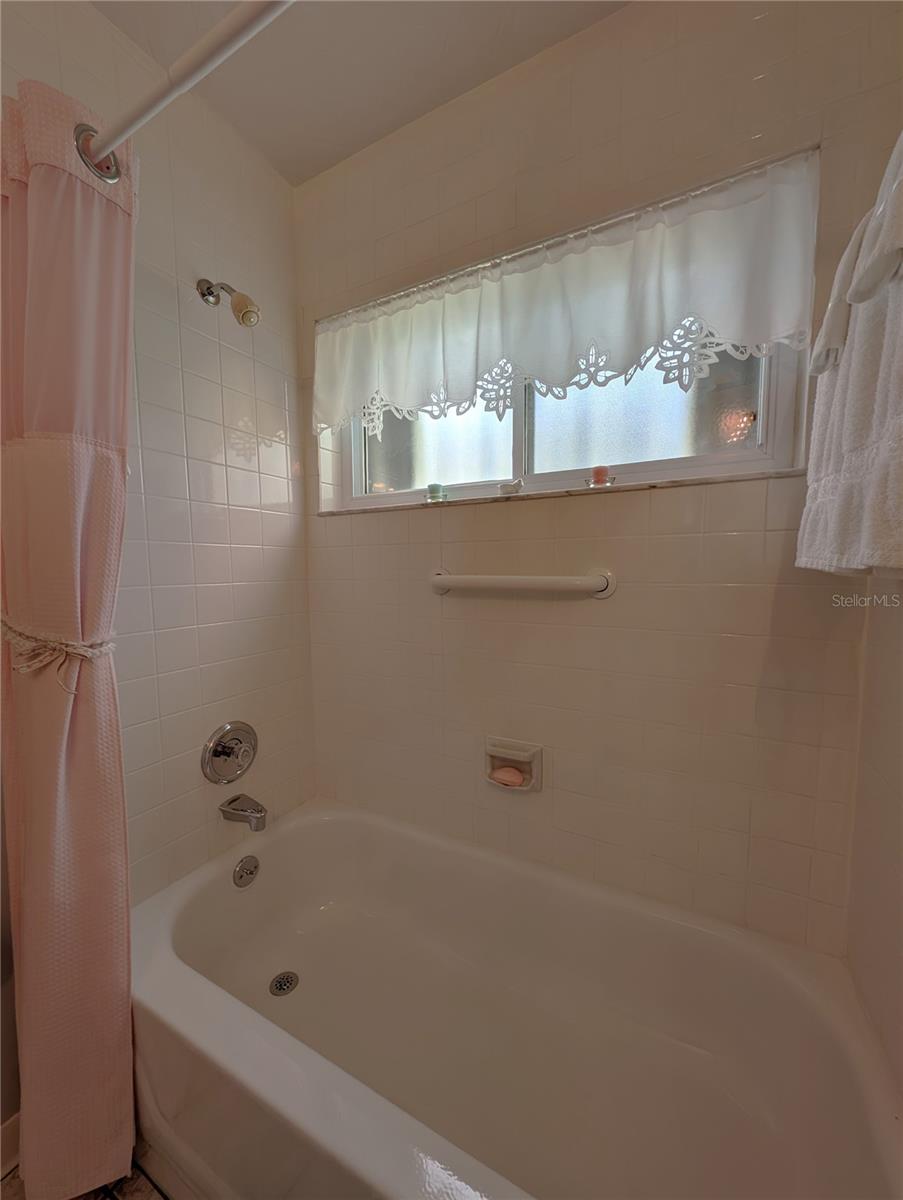 Guests have option of a quick shower or a relaxing soak in the tub.  Grab bar available for safe maneuvering.