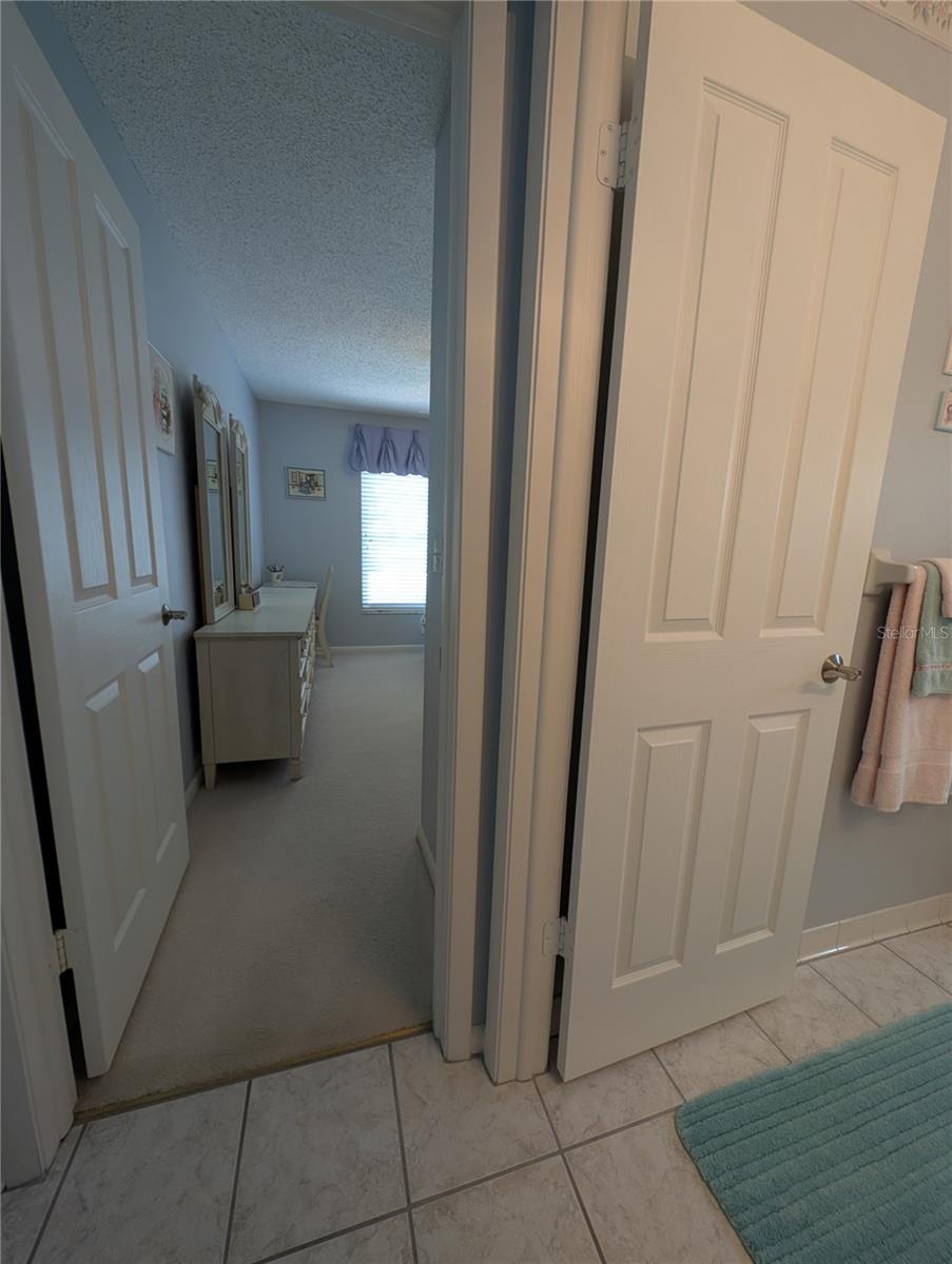 View from entries into main bath and Guest Bedroom.  A private suite for your family and friends.