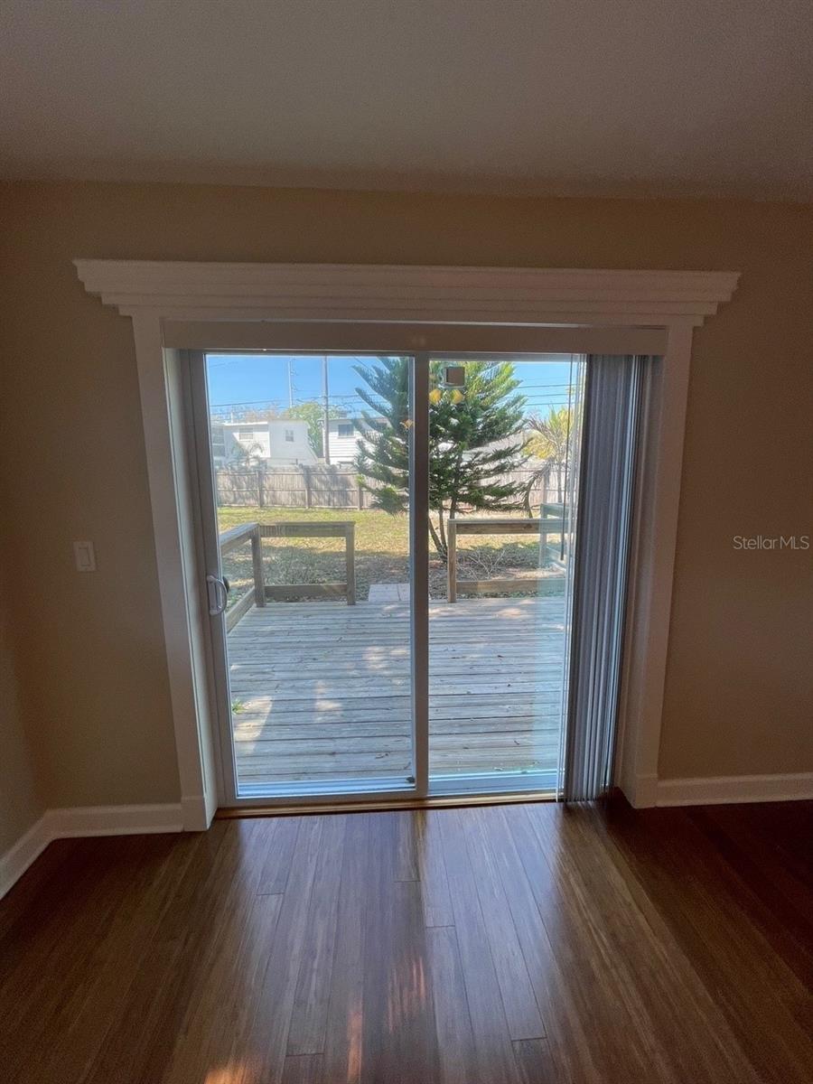 Master bedroom sliding door access to back patio
