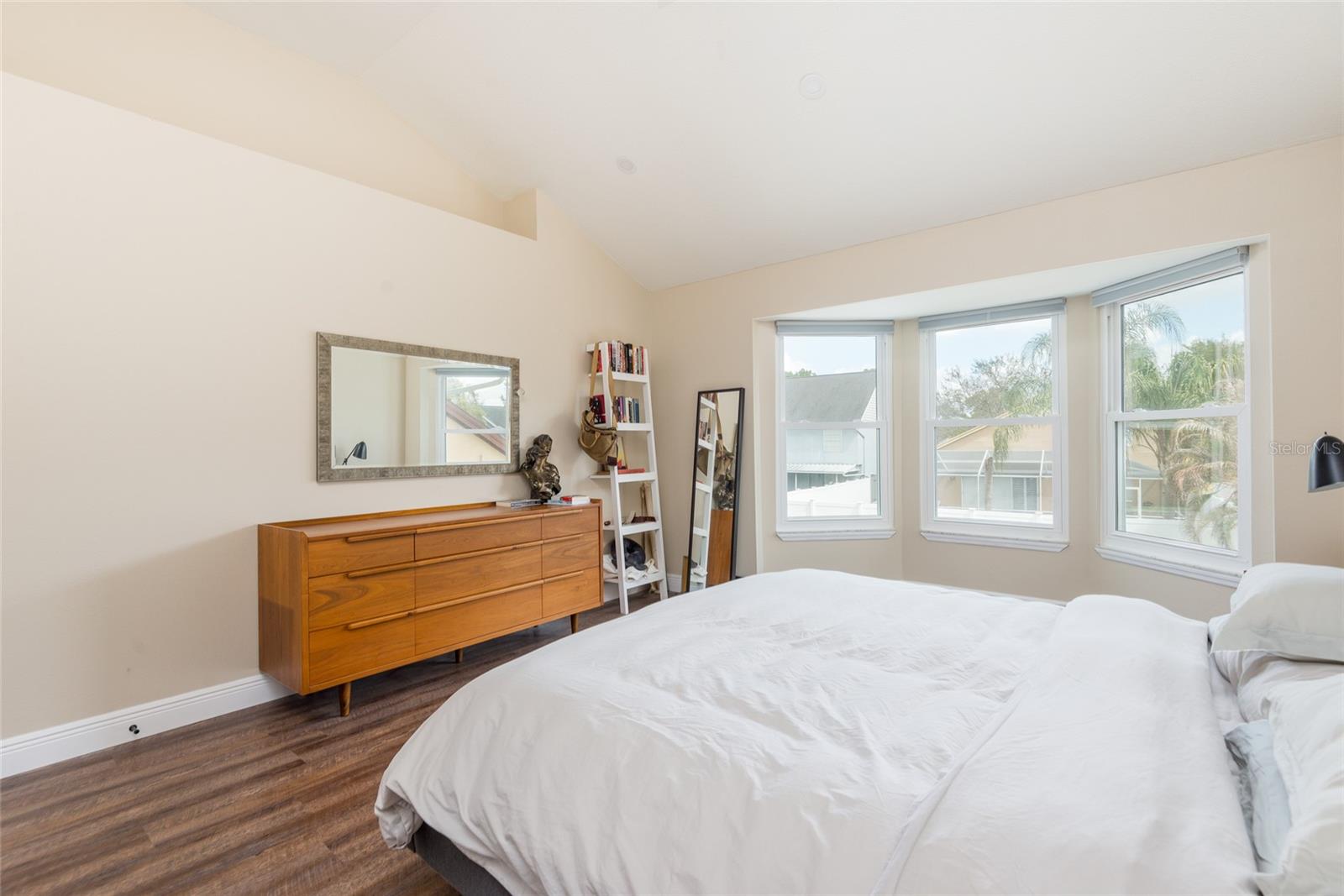 The roomy primary suite has a bay window