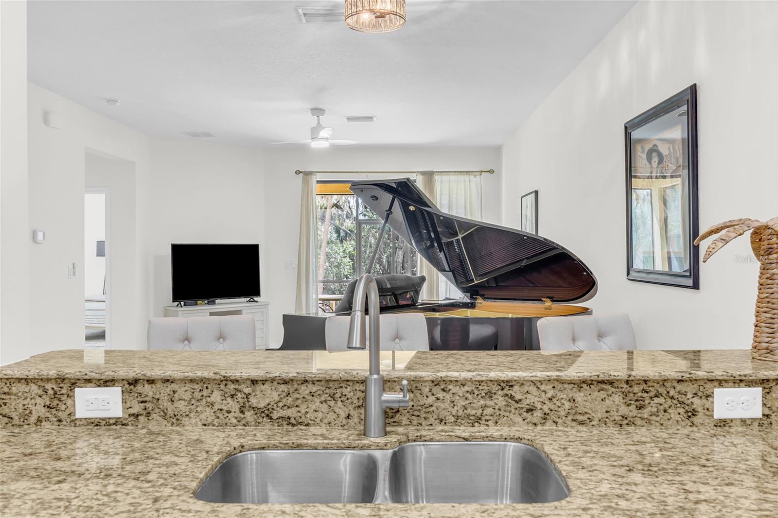 Kitchen looking into dining room and living area
