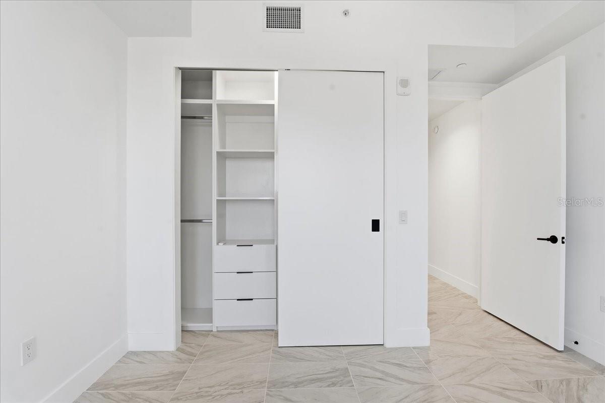CUSTOM BUILT CLOSET IN THE GUEST BEDROOM