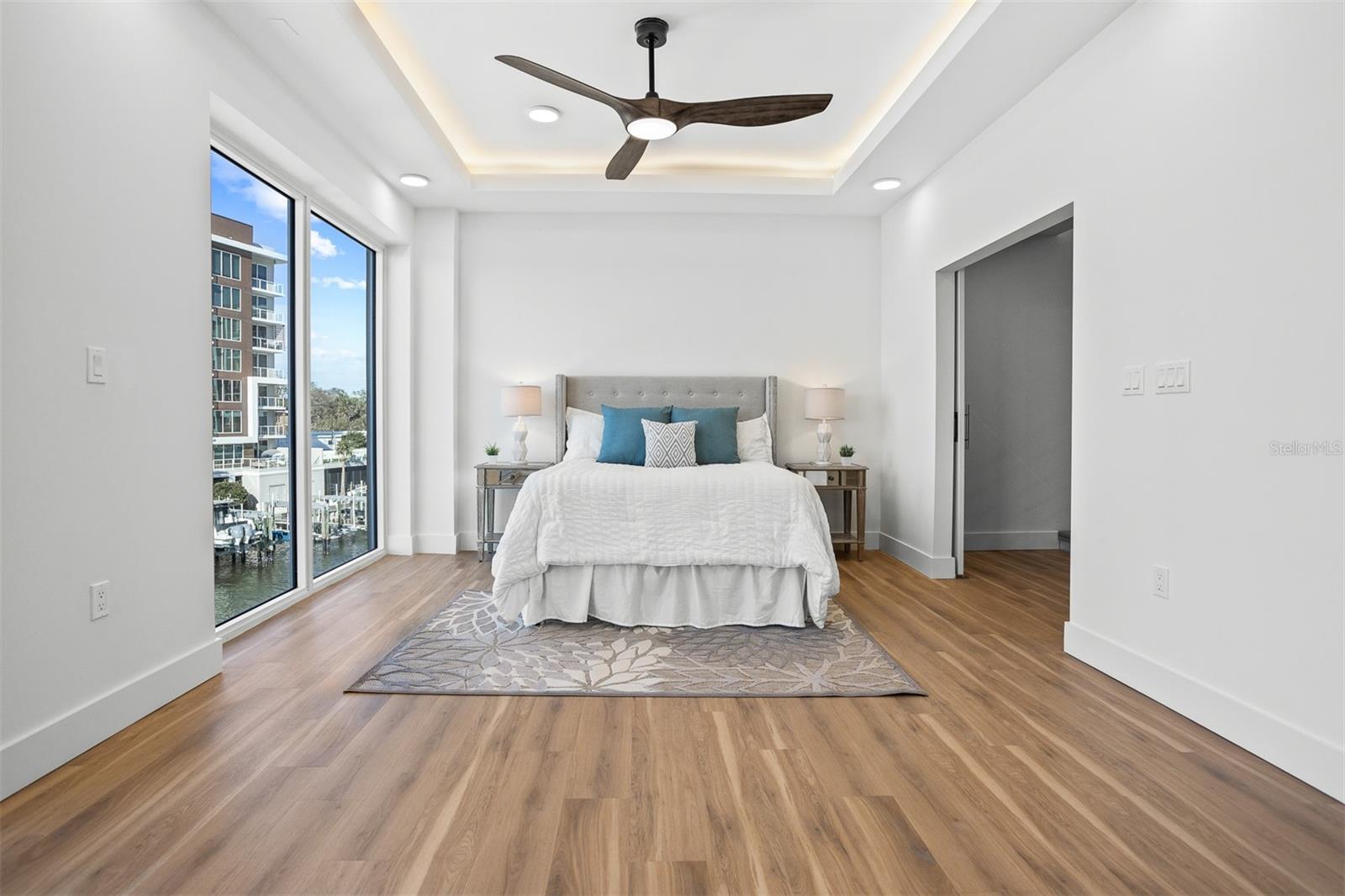 Primary suite with water views, high ceilings, walk-in closets and more!