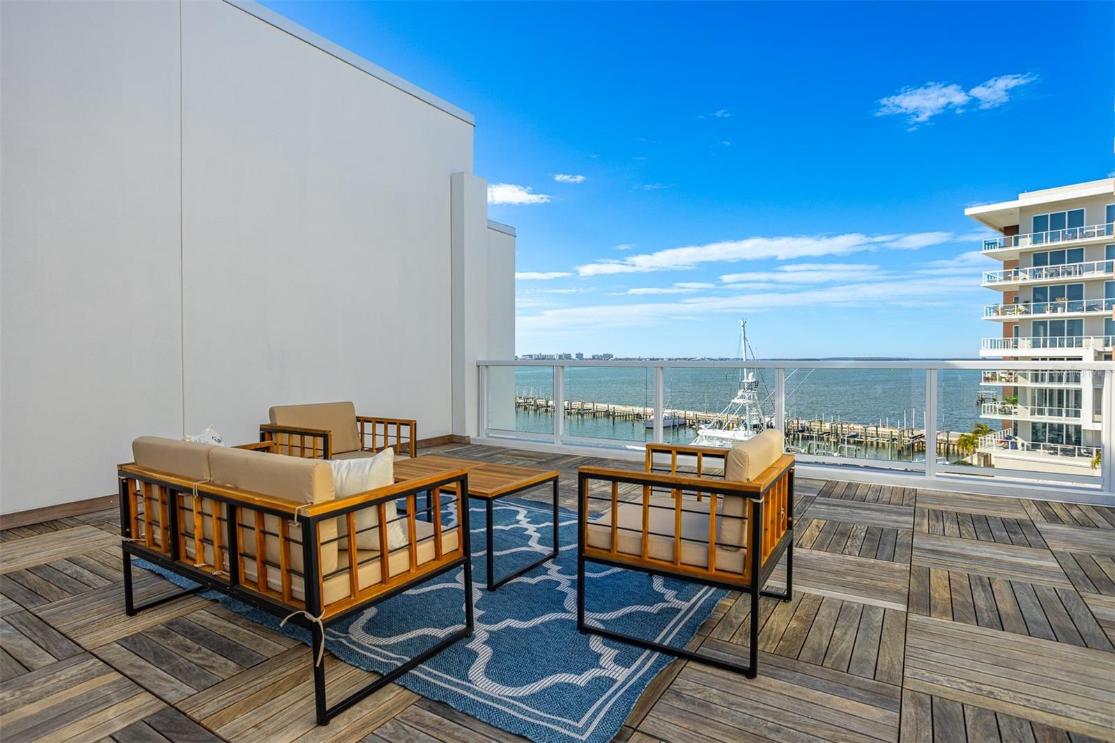 Rooftop sitting area with kitchenette, grill and did I mention those views!