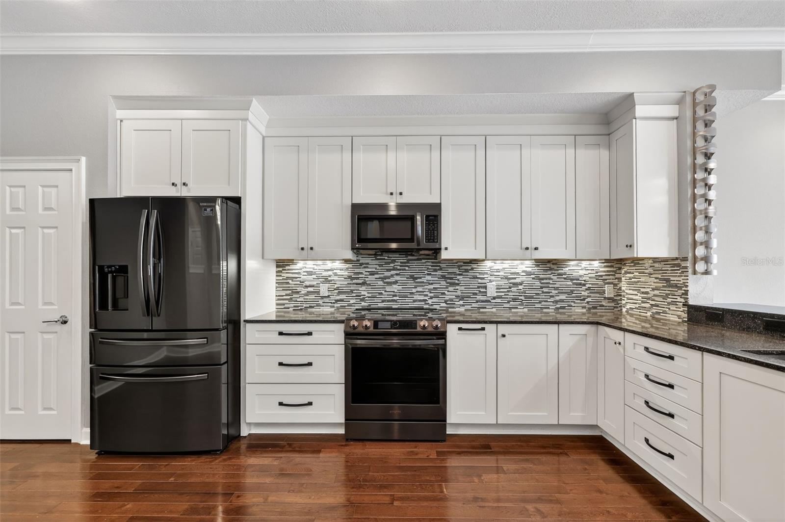 The dining room is open and spacious and leads into the kitchen.