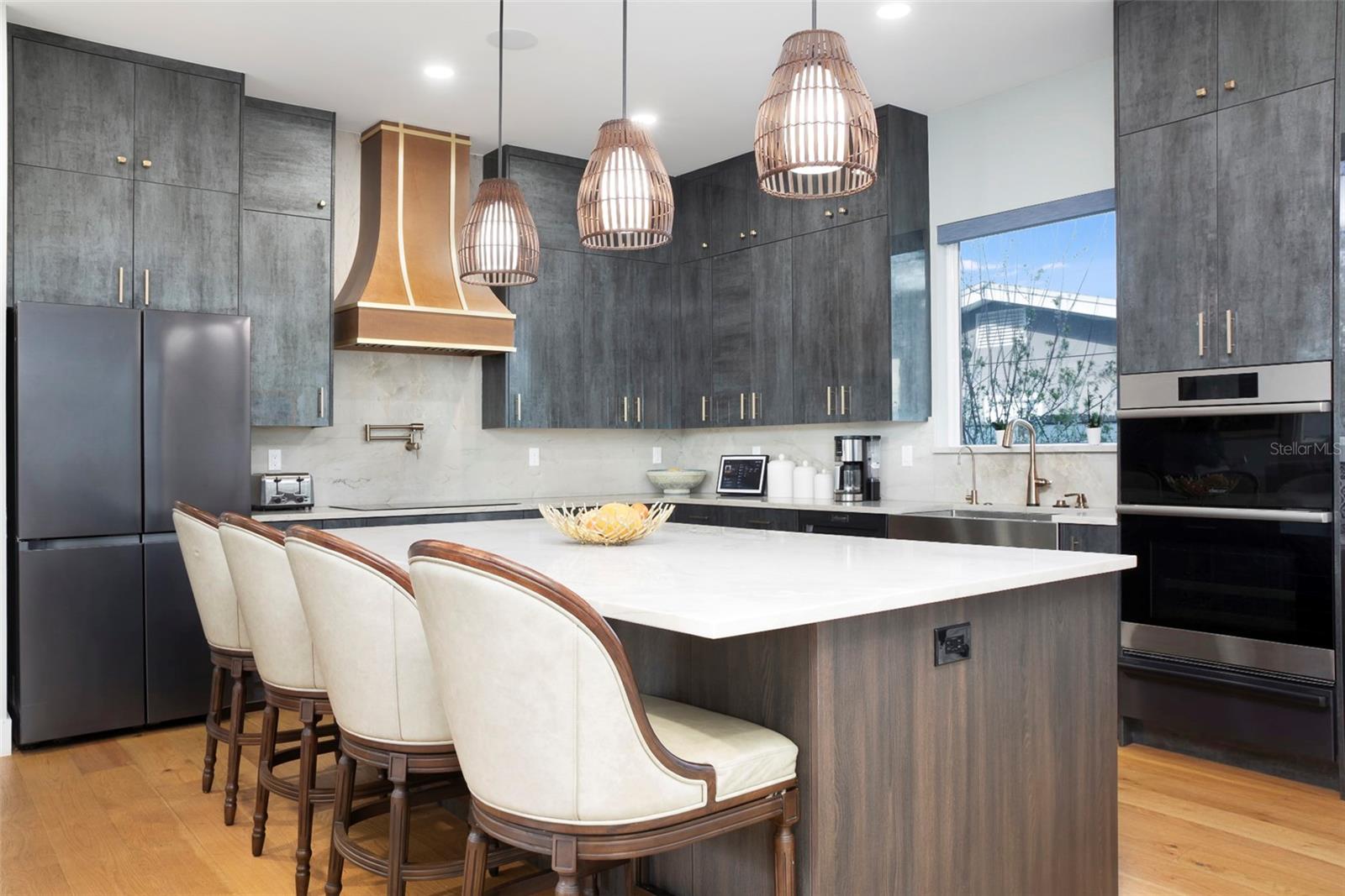 Quartzite-Topped Island with Beautiful Pendant Lighting