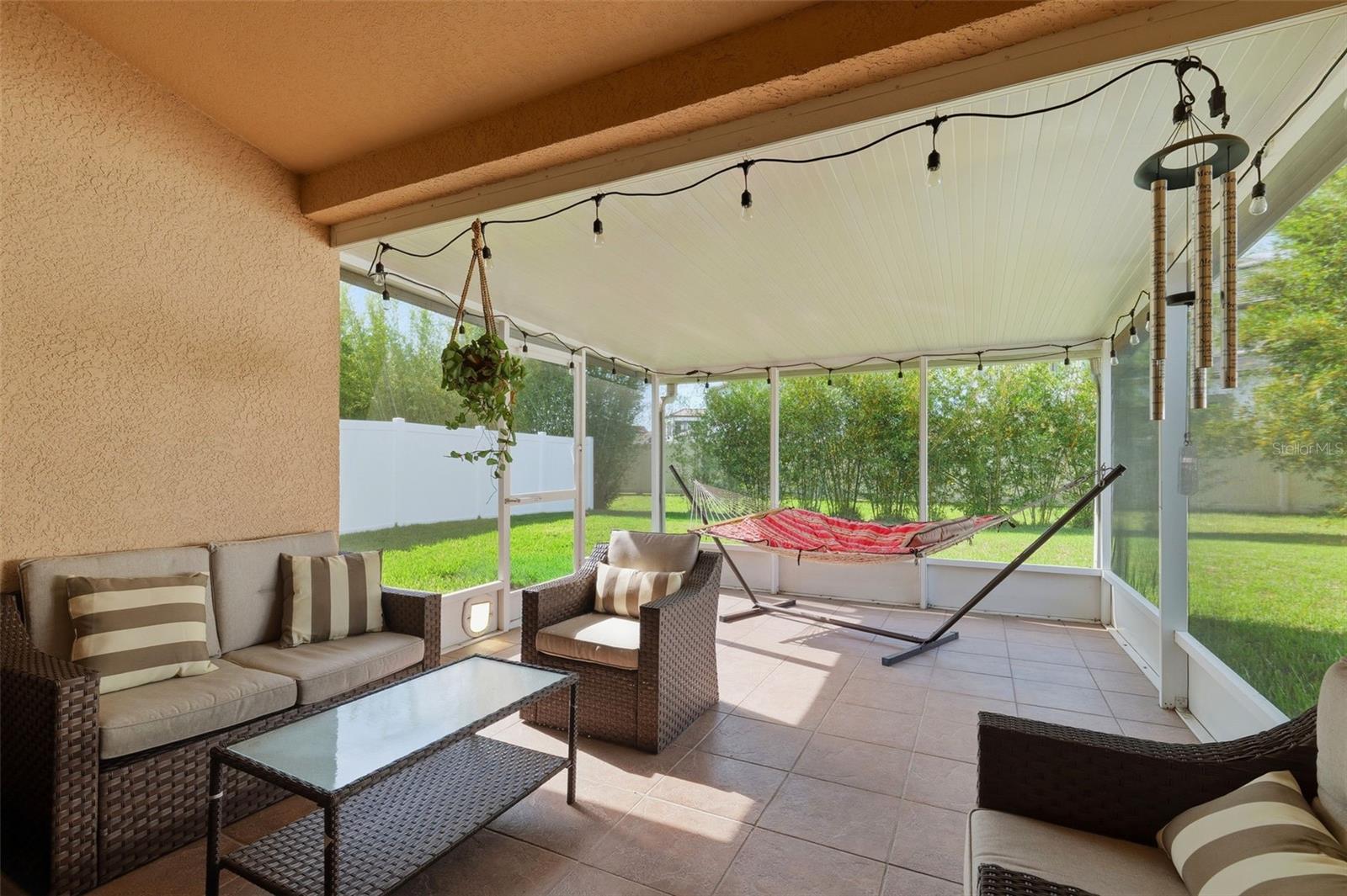 Covered, screened in back patio