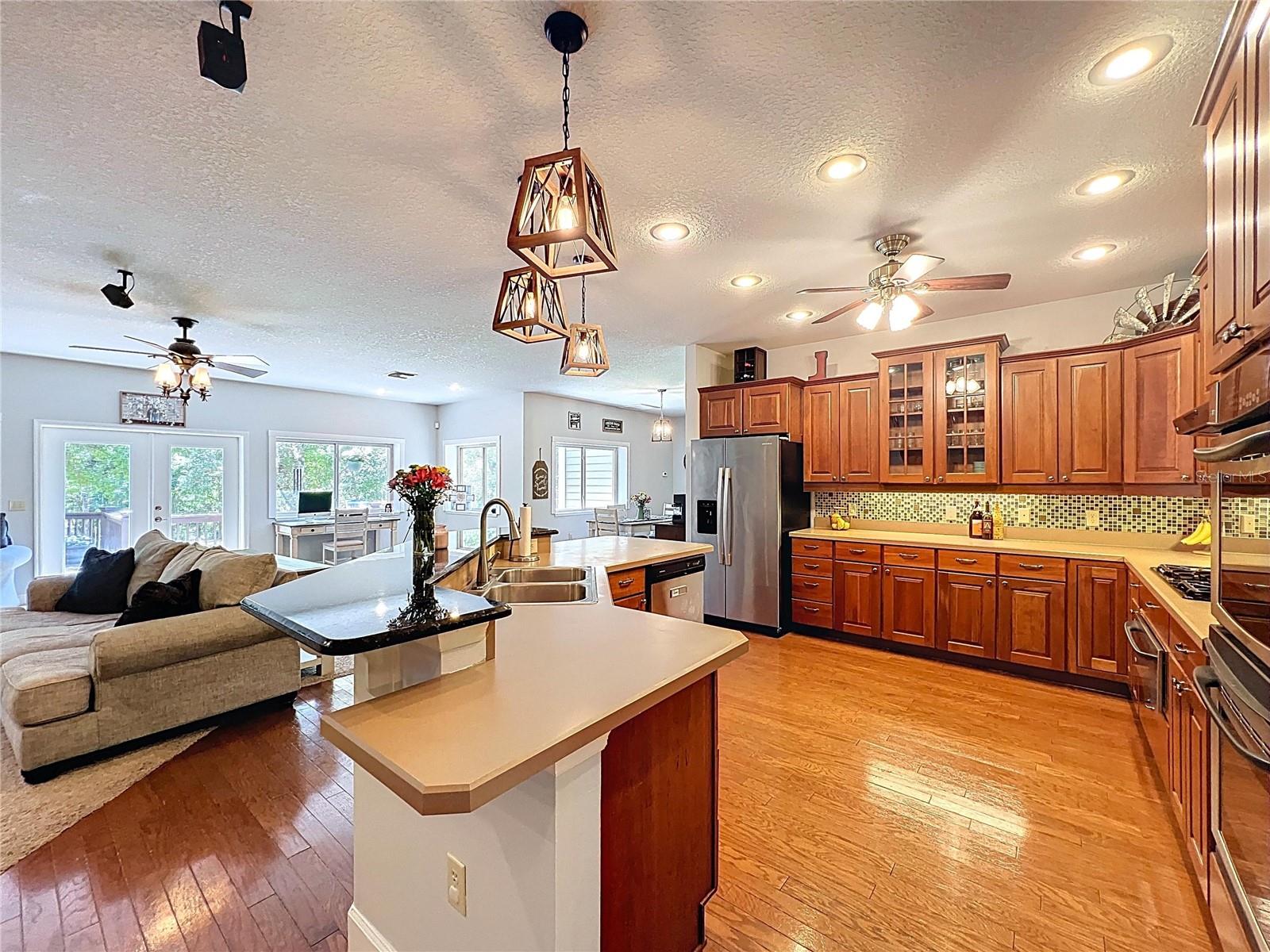 HARDWOOD FLOORS CONTINUE INTO THE KITCHEN