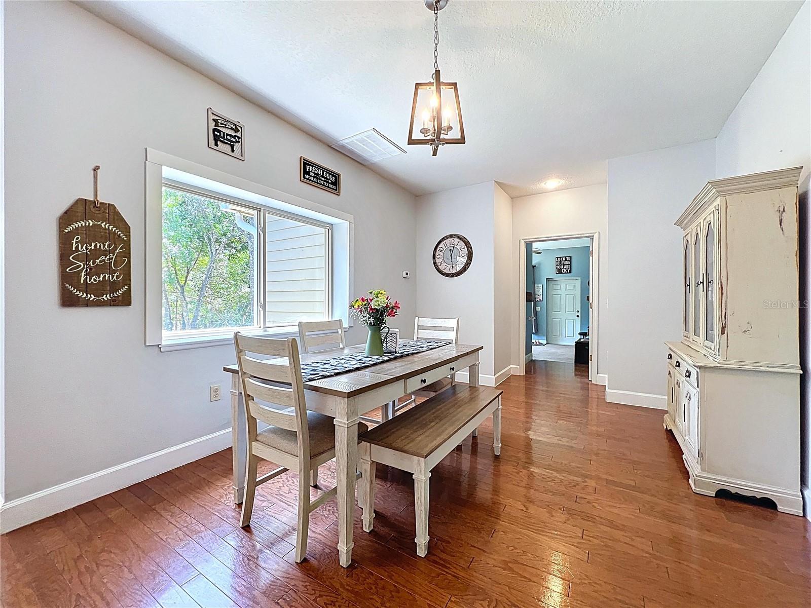 DINING AREA  WITH HARDWOOD FLOORS