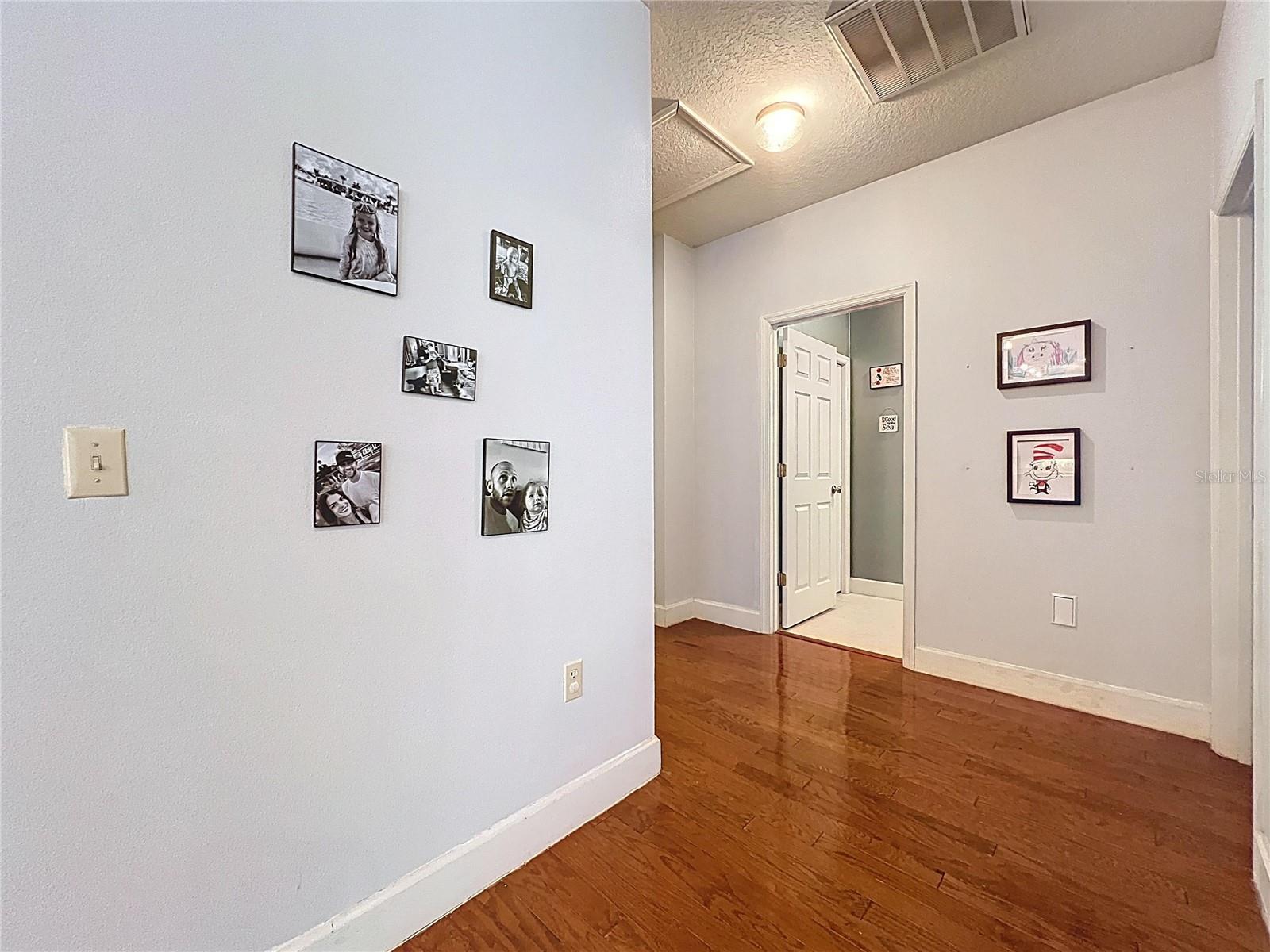 HALL TO PRIMARY BEDROOM AND BEDROOM 2