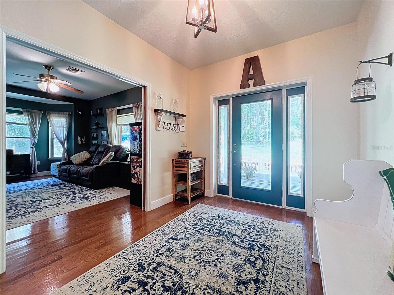 FOYER WITH HARDWOOD FLOORING LOOKING INTO DEN, OFFICE OR 4TH BEDROOM FLEXSPACE