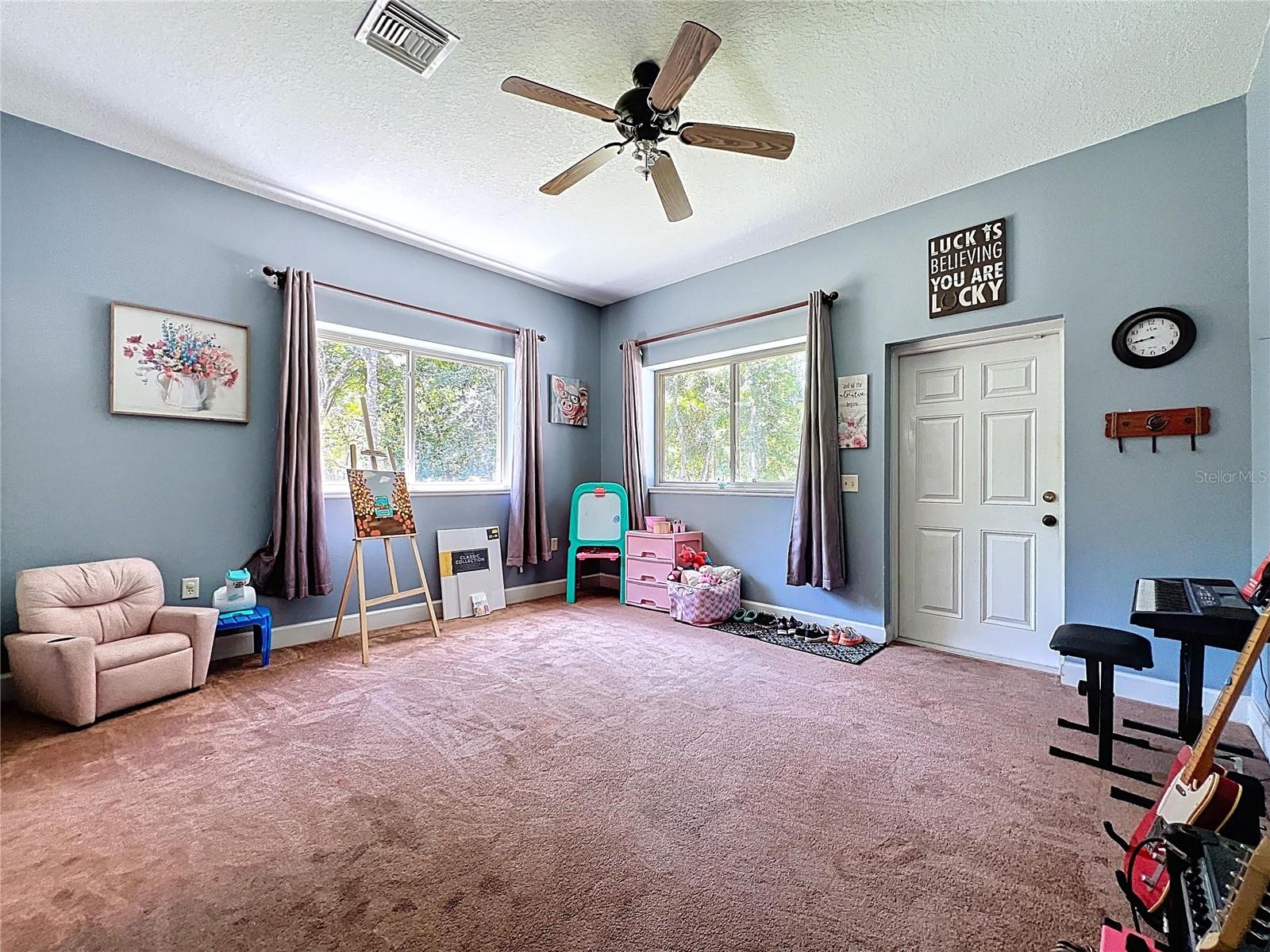 GUEST SUITE WITH PRIVATE EXTERIOR ENTRANCE IS CURRENTLY USED AS A PLAYROOM