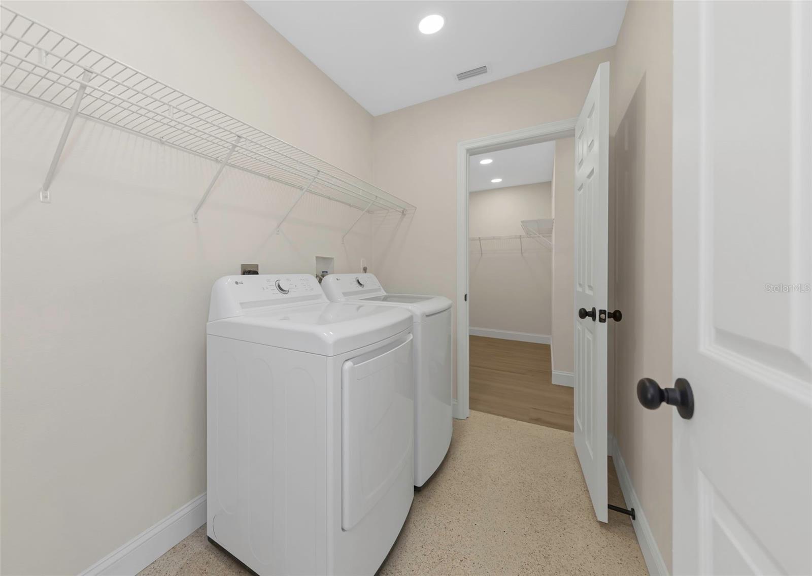 Interior laundry room complete with brand new LG washer and dryer.