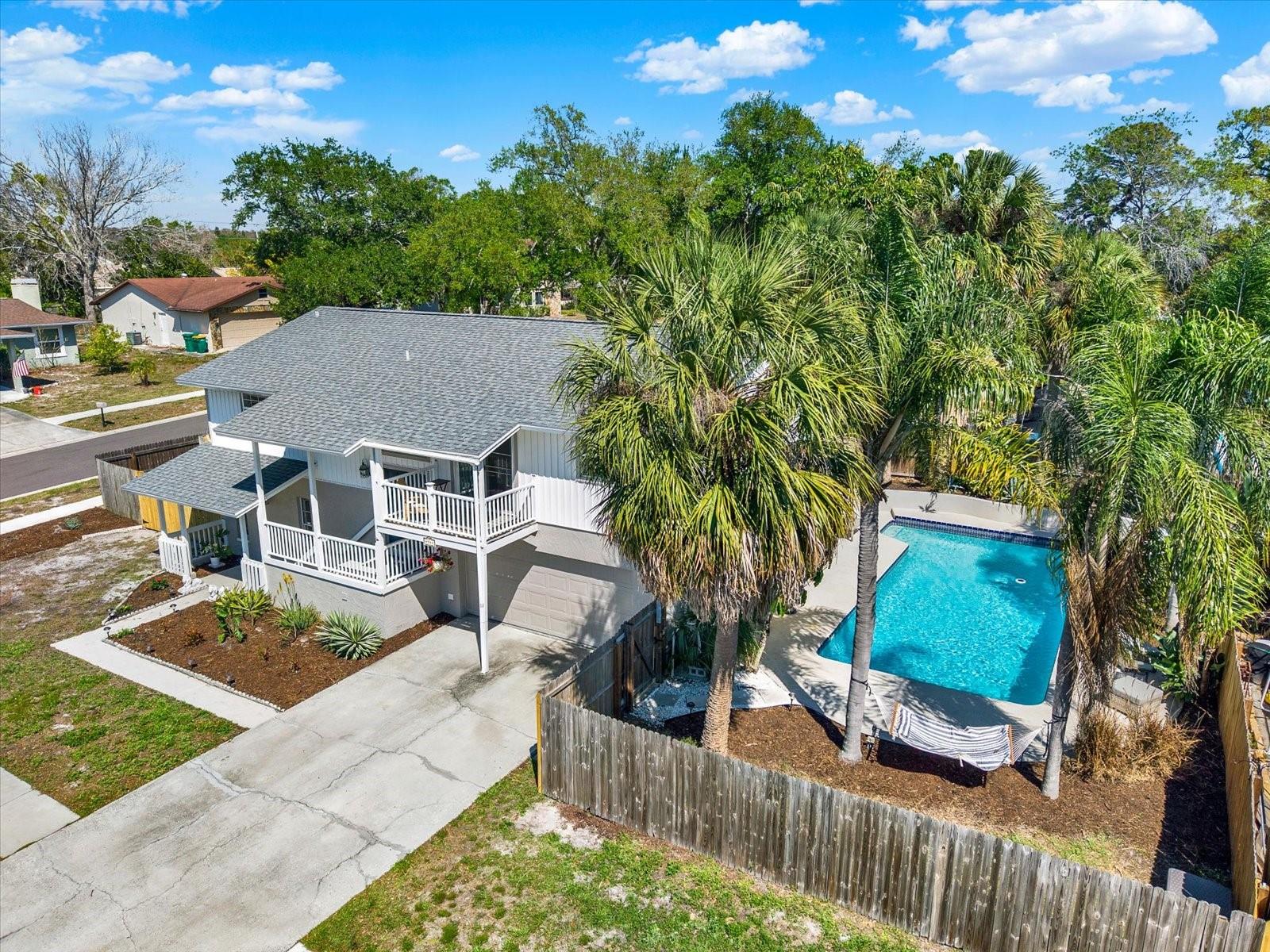 Oversized Corner Lot with a private pool and enclosed outdoor boat parking.