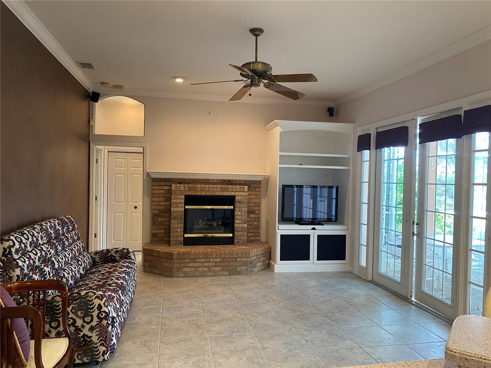 Family room with wood burning fireplace