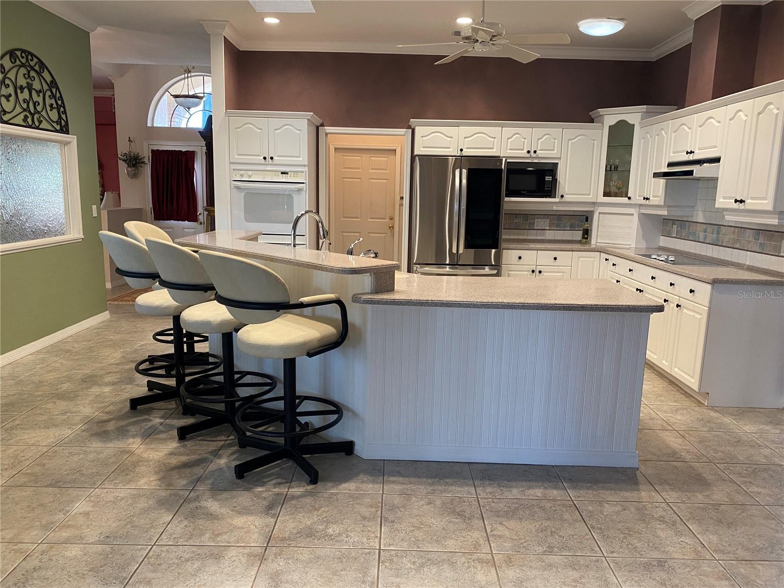 Large kitchen with expansive Island with seating