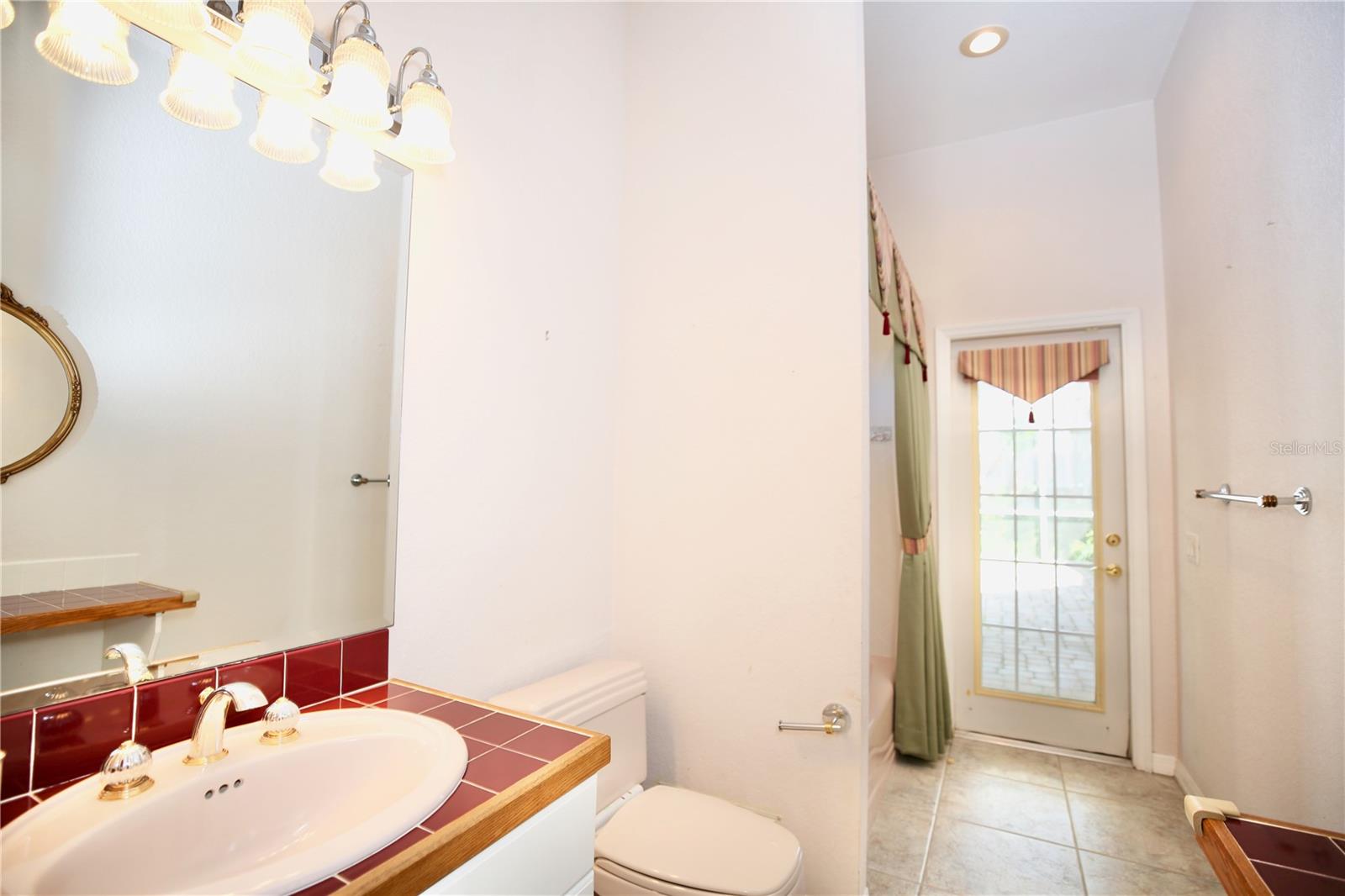 3rd bedroom bathroom with full tub and shower