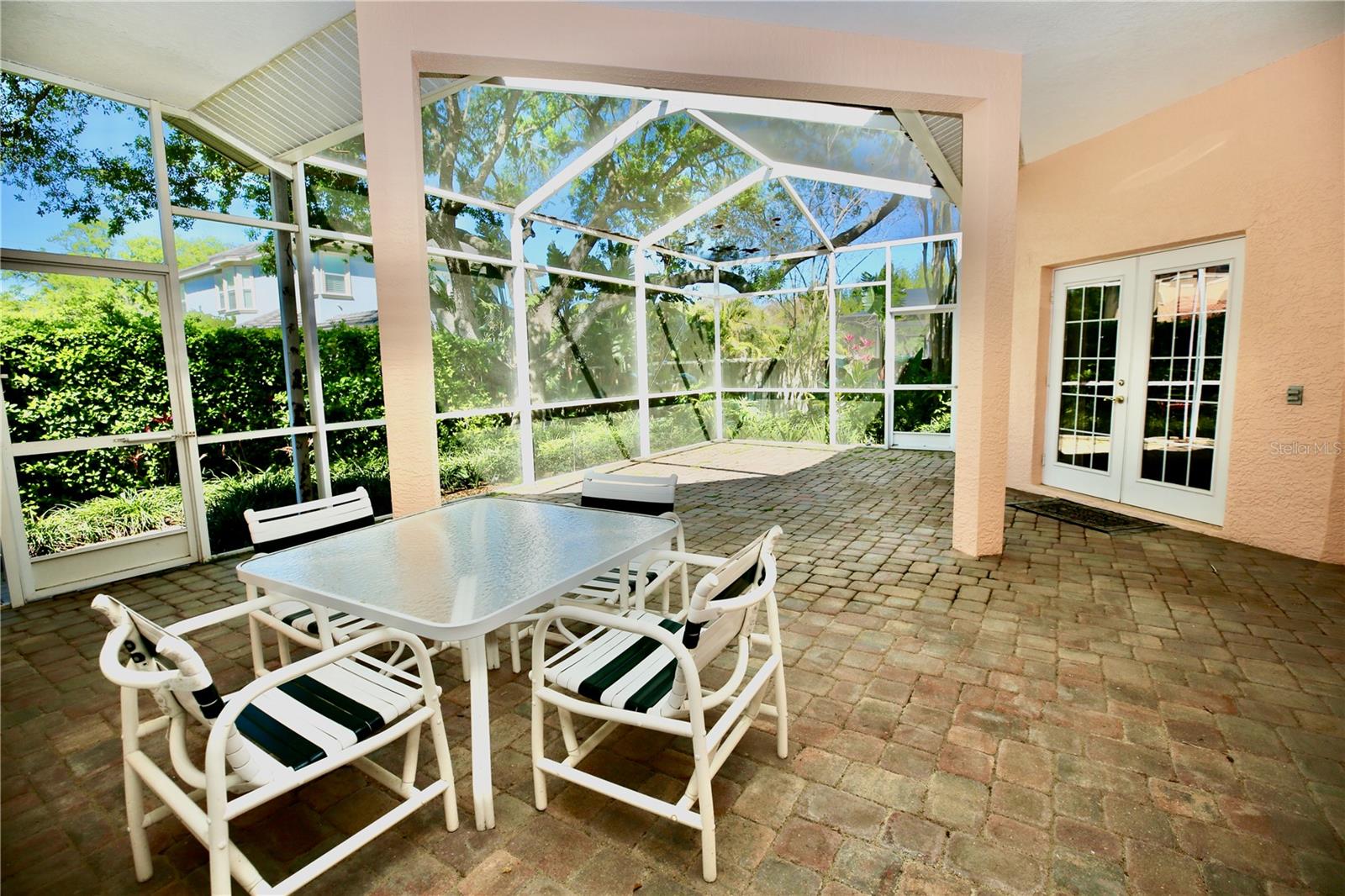 Large patio area with enclosed birdcage