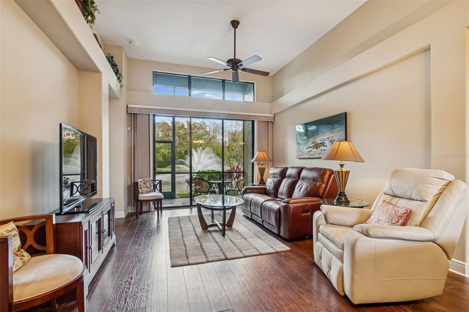 Living room with views to the pond and water feature