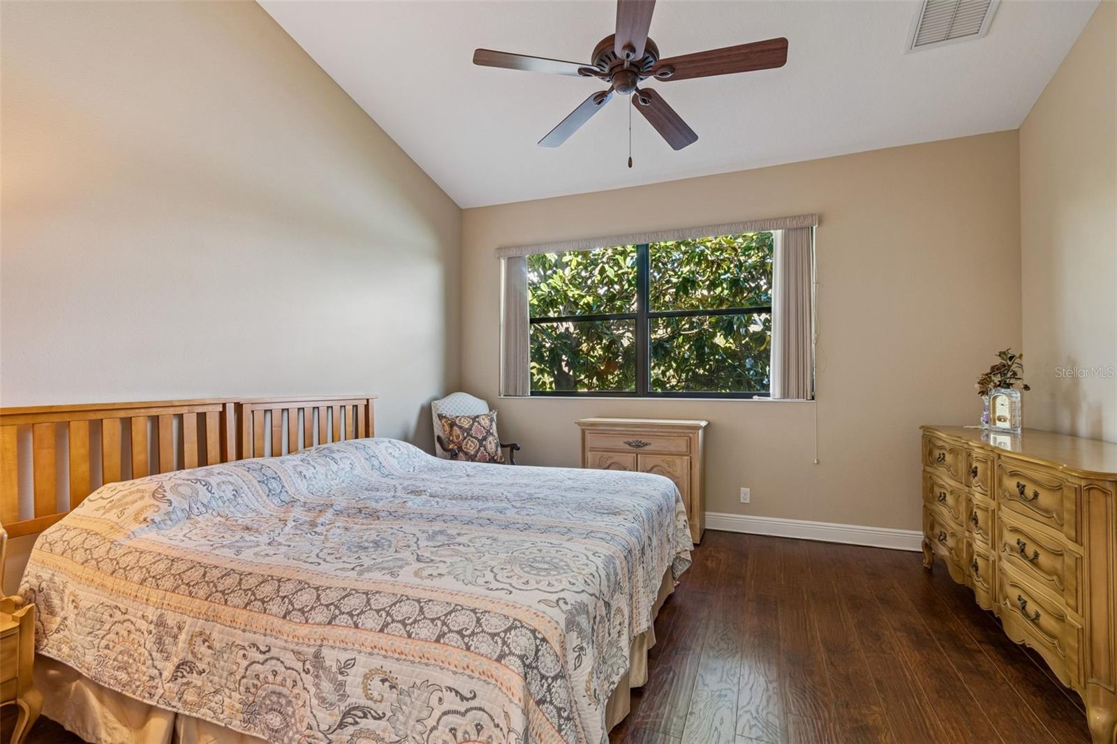 Primary bedroom with views to the pond and water feature