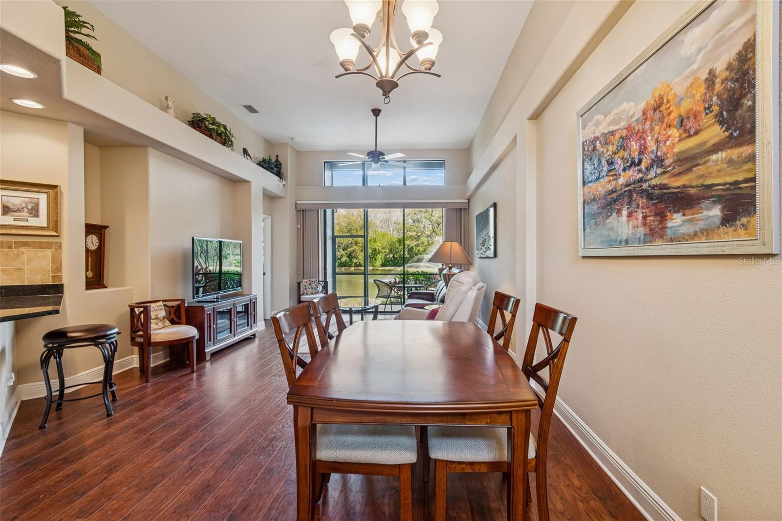 Combination dining and living, with views to the pond