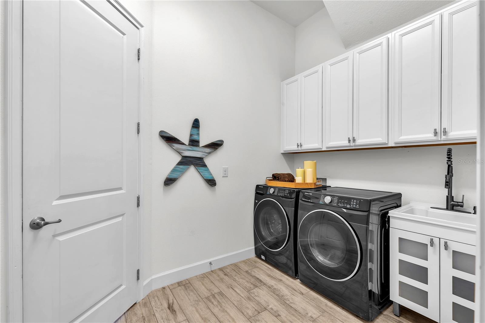 Laundry room includes a utility sink and has direct access to the oversized garage.