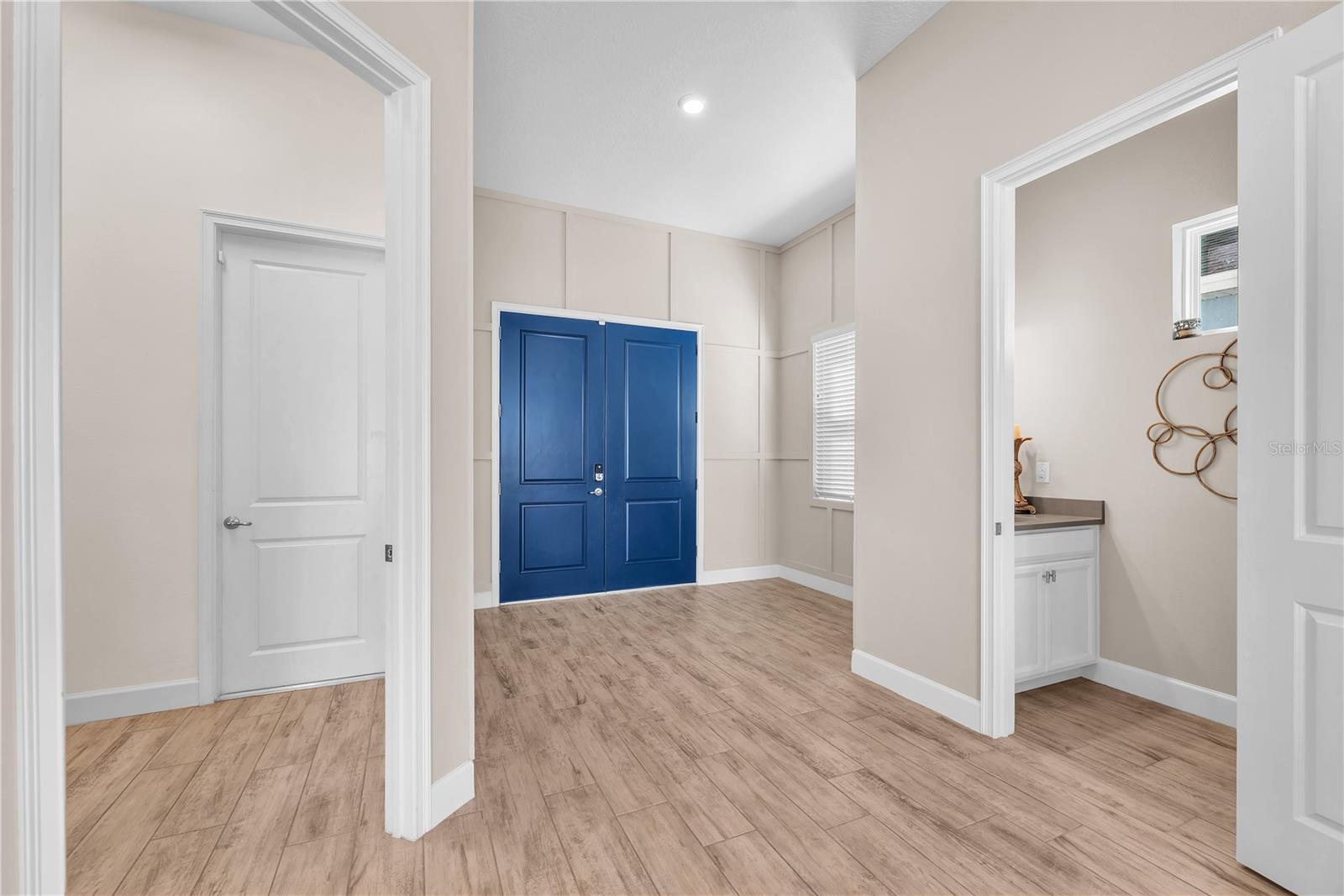Foyer, half bathroom and laundry room and garage access.