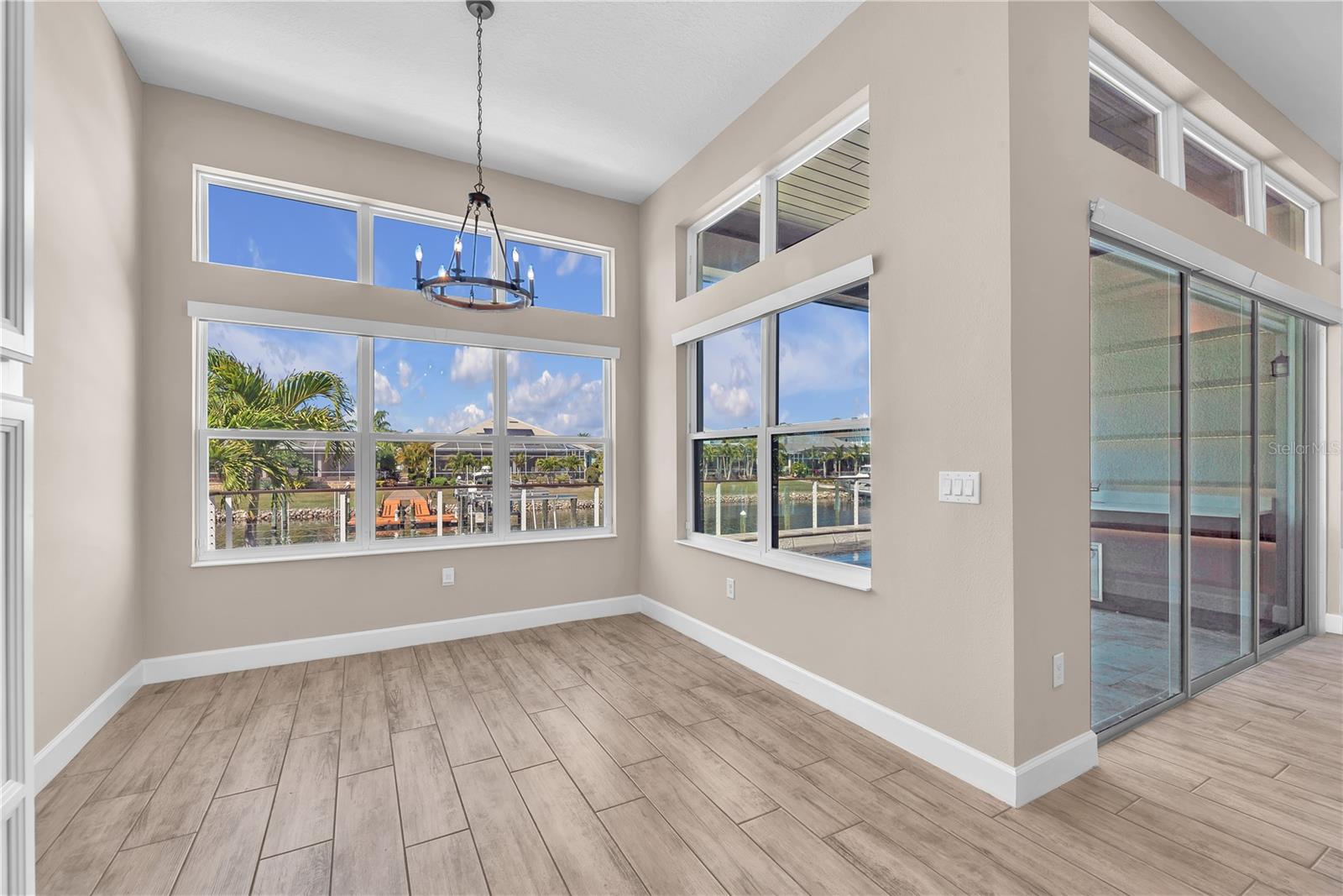 Eat in area overlooking the water and pool.