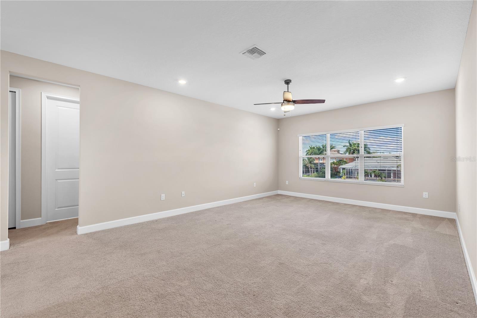 Upstairs, a versatile bonus room provides flexible space for a media room, playroom, or a fifth bedroom.